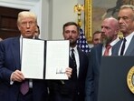 President Donald Trump holds up a signed executive order restarting the Presidential Fitness Test in public schools as Commerce Secretary Howard Lutnick, from left, professional golfer Bryson DeChambeau, WWE CCO Triple H and Health and Human Services Secretary Robert F. Kennedy Jr. watch. President Donald Trump holds up a signed executive order restarting the Presidential Fitness Test in public schools as Commerce Secretary Howard Lutnick, from left, professional golfer Bryson DeChambeau, WWE CCO Triple H and Health and Human Services Secretary Robert F. Kennedy Jr. watch.