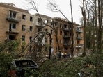 Rescuers work in front of an apartment building hit during Russian missile and drone strikes, amid Russia’s attack on Ukraine, in Kyiv, Ukraine.