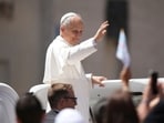Pope Leo XIV was making his way through the crowd in the Vatican, when he saw a pizza sign and stopped in his tracks.