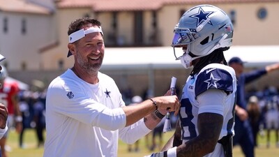 Dallas Cowboys head coach Brian Schottenheimer, left, talks with wide receiver CeeDee Lamb during training camp Thursday, July 31, 2025, in Oxnard, Calif. (AP Photo/Mark J. Terrill) (AP) Dallas Cowboys head coach Brian Schottenheimer, left, talks with wide receiver CeeDee Lamb during training camp Thursday, July 31, 2025, in Oxnard, Calif. (AP Photo/Mark J. Terrill) (AP)