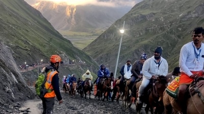 Torrential rains in Kashmir had rendered the roads unsafe, following which the pilgrimage was suspended on both the Baltal and Pahalgam routes on Wednesday. (PTI) Torrential rains in Kashmir had rendered the roads unsafe, following which the pilgrimage was suspended on both the Baltal and Pahalgam routes on Wednesday. (PTI)