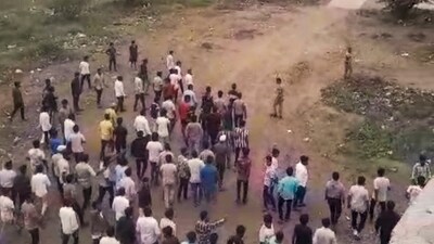 People gather after two groups clashed over a social media post, in Yavat in Pune's Daund tehsil, Friday. (PTI) People gather after two groups clashed over a social media post, in Yavat in Pune's Daund tehsil, Friday. (PTI)