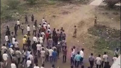 People gather after two groups clashed over a social media post, in Yavat in Pune's Daund tehsil, Friday. (PTI) People gather after two groups clashed over a social media post, in Yavat in Pune's Daund tehsil, Friday. (PTI)
