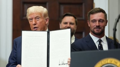 US President Donald Trump displays a signed executive order at the White House in Washington, DC. (Bloomberg) US President Donald Trump displays a signed executive order at the White House in Washington, DC. (Bloomberg)