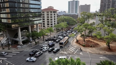 Beachgoers gather at Waikiki Beach after authorities downgraded earlier tsunami warnings following an earthquake (REUTERS)