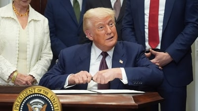 President Donald Trump signs an executive order in the Roosevelt Room of the White House in Washington. (AP Photo/Jacquelyn Martin) (AP) President Donald Trump signs an executive order in the Roosevelt Room of the White House in Washington. (AP Photo/Jacquelyn Martin) (AP)