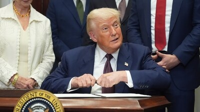 President Donald Trump signs an executive order on new tariffs in the Roosevelt Room of the White House in Washington. (AP)