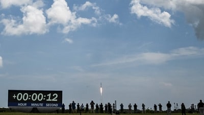 A SpaceX Falcon 9 rocket carrying the Crew-11 mission successfully lifted off from Launch Complex 39A at NASA’s Kennedy Space Center in Florida on August 1, 2025. The Crew Dragon capsule, named Endeavour, is transporting a new team of astronauts to the International Space Station. People were also gather around to witness the moment. (Photo by CHANDAN KHANNA / AFP) (AFP) A SpaceX Falcon 9 rocket carrying the Crew-11 mission successfully lifted off from Launch Complex 39A at NASA’s Kennedy Space Center in Florida on August 1, 2025. The Crew Dragon capsule, named Endeavour, is transporting a new team of astronauts to the International Space Station. People were also gather around to witness the moment. (Photo by CHANDAN KHANNA / AFP) (AFP)