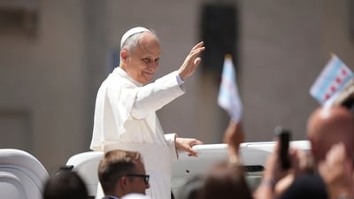 Pope Leo XIV was making his way through the crowd in the Vatican, when he saw a pizza sign and stopped in his tracks. (AP) Pope Leo XIV was making his way through the crowd in the Vatican, when he saw a pizza sign and stopped in his tracks. (AP)