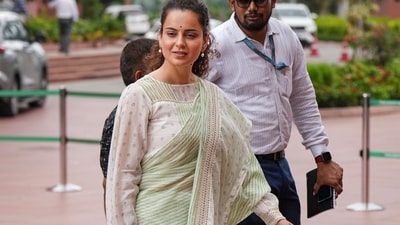 Minimalist elegance that is graceful, grounded and perfectly Parliament-ready! The BJP MP opted for an unconventional piece - a delicate pastel green and ivory striped handloom-inspired saree paired with a loose-fitted, full sleeves blouse. (Arun Sharma/PTI)