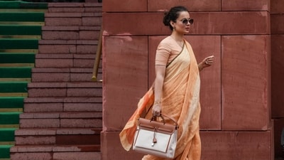 The Bollywood actor stepped into a session wearing muted earthy tones - a soft saffron-orange ensemble with delicate gold accents, paired with her signature Birkin. (Arun Sharma/PTI)