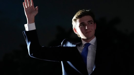Barron Trump waves as his father President Donald Trump, speaks at a campaign rally at Trump National Doral Miami on July 9, 2024. (AP/Rebecca Blackwell)