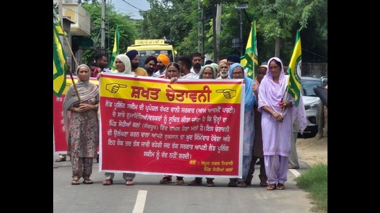 Villagers protesting against the Punjab government’s land pooling scheme at Sangrur’s Sohiana village on Friday. (HT)