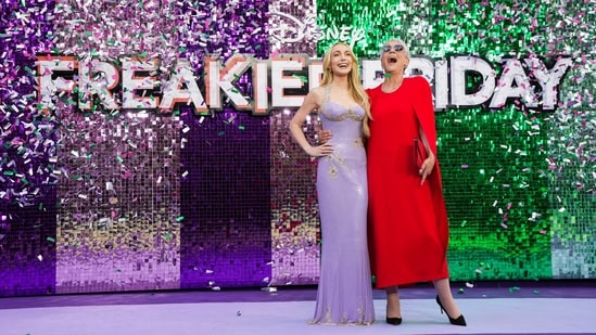 Lohan posing alongside Jamie Lee Curtis. The 2025 reboot sees the duo reprising their roles of Anna and Tess Coleman.(AP)