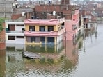 A low-lying area in Prayagraj inundated with floodwaters on Saturday. (Anil Kumar Maurya/HT)