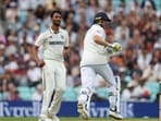 England's Joe Root in action as India's Prasidh Krishna reacts after bowling