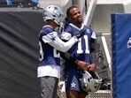 Dallas Cowboys cornerback C.J. Goodwin, left, talks with defensive end Micah Parsons during training camp Dallas Cowboys cornerback C.J. Goodwin, left, talks with defensive end Micah Parsons during training camp