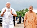 Prime Minister Narendra Modi and chief minister Yogi Adityanath upon the former’s arrival to address a public meeting, in Varanasi on Saturday. (PTI PHOTO) Prime Minister Narendra Modi and chief minister Yogi Adityanath upon the former’s arrival to address a public meeting, in Varanasi on Saturday. (PTI PHOTO)