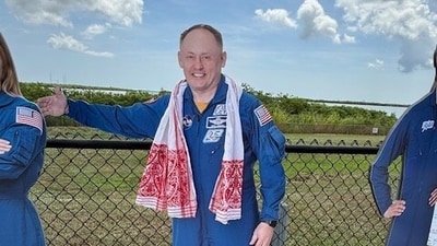 Since the real Mike Fincke was in quarantine, we adorned NASA's cardboard cutout with a gamosa every chance we could. (S. Mitra Kalita) Since the real Mike Fincke was in quarantine, we adorned NASA's cardboard cutout with a gamosa every chance we could. (S. Mitra Kalita)