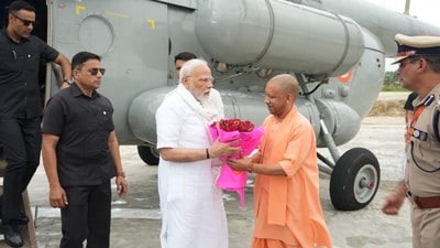 UP chief minister Yogi Adityanath greets Prime Minister Modi with a bouquet of flowers after he landed at Varanasi. (Sourced from CMO) UP chief minister Yogi Adityanath greets Prime Minister Modi with a bouquet of flowers after he landed at Varanasi. (Sourced from CMO)