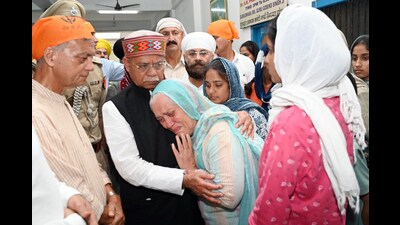 Himachal Pradesh governor Shiv Pratap Shukla interact with flood victims in Mandi on Saturday. (Birbal Sharma/HT)