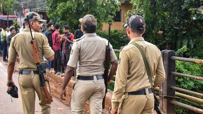 Security personnel keep vigil during examination by a Special Investigation Team (SIT) in the Dharmasthala mass burial case, (PTI/File)