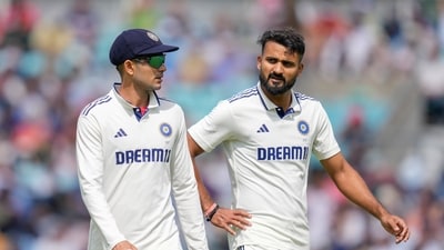Shubman Gill speaks to Akash Deep during his spell at the Oval. (PTI) Shubman Gill speaks to Akash Deep during his spell at the Oval. (PTI)