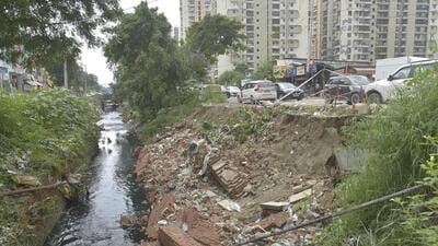The drain opposite the Crossings Republik township on Saturday. (Sakib Ali/HT Photo) The drain opposite the Crossings Republik township on Saturday. (Sakib Ali/HT Photo)