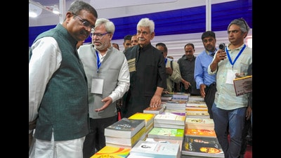 Union education minister Dharmendra Pradhan with Jammu and Kashmir Lt governor Manoj Sinha at a stall during inaugural ceremony of the 'Chinar Book Festival', at SKICC in Srinagar, Saturday. (PTI) Union education minister Dharmendra Pradhan with Jammu and Kashmir Lt governor Manoj Sinha at a stall during inaugural ceremony of the 'Chinar Book Festival', at SKICC in Srinagar, Saturday. (PTI)