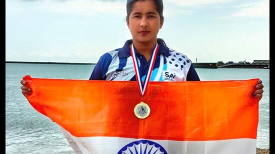 Afrin Jabee holding an Indian Tricolour after her achievement. (Sourced)