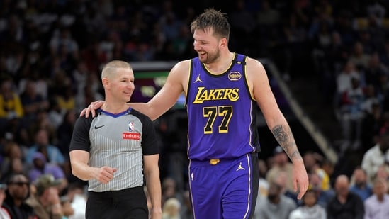 Los Angeles Lakers guard Luka Doncic (77) talks with referee Tyler Ford in the second half vs Memphis Grizzlies (AP)