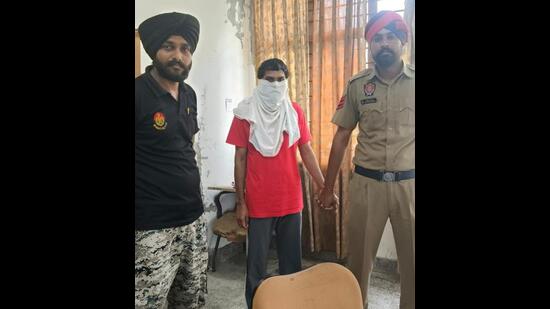 Parveen Lonkar in police custody in Fazilka on Saturday. (HT Photo)