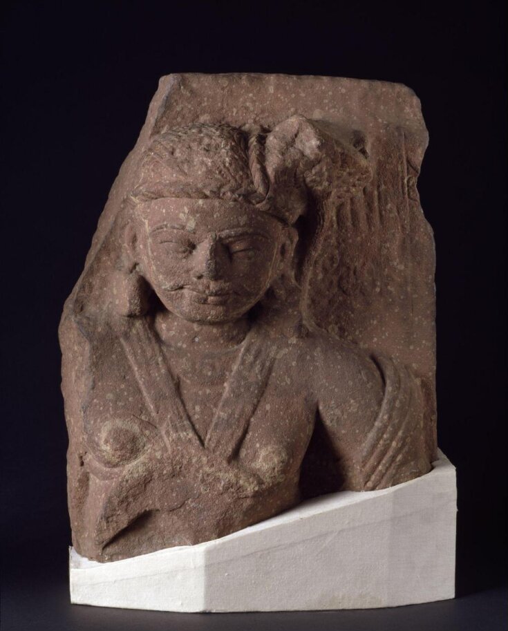 A Buddhist sculpture of a a Bodhisattva or dwarapala (guardian of the gate) from the 2nd century CE. Made of sandstone, it was likely part of a pillar or a stupa wall. (V&A East Storehouse)