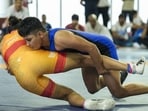 Antim Panghal (blue) and Hinaben compete in the 53 kg event during trials for the World Wrestling Championships 2025 at Indira Gandhi Arena, in New Delhi. (PTI)