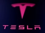 Tesla owners can plug in their vehicles and check stall availability through the Tesla app. 