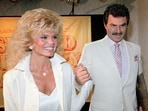 FILE - Burt Reynolds, right, holds hands with Loni Anderson at a luncheon, March 27, 1987, in Los Angeles.