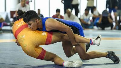 Antim Panghal (blue) and Hinaben compete in the 53 kg event during trials for the World Wrestling Championships 2025 at Indira Gandhi Arena, in New Delhi. (PTI) Antim Panghal (blue) and Hinaben compete in the 53 kg event during trials for the World Wrestling Championships 2025 at Indira Gandhi Arena, in New Delhi. (PTI)