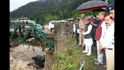 Himachal Pradesh governor Shiv Pratap Shukla along with leader of the Opposition Jai Ram Thakur visits the cloudburst-hit area at Seraj in Mandi on Sunday. (Birbal Sharma/ HT)