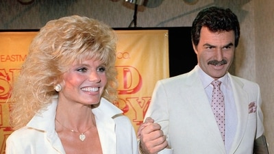 FILE - Burt Reynolds, right, holds hands with Loni Anderson at a luncheon, March 27, 1987, in Los Angeles. (AP) FILE - Burt Reynolds, right, holds hands with Loni Anderson at a luncheon, March 27, 1987, in Los Angeles. (AP)