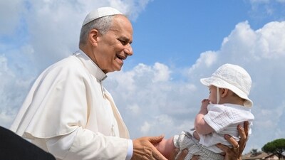 Pope Leo XIV blesses a child, on the day of a Mass for Jubilee of Youth in Tor Vergata, in Rome, Italy, August 3, 2025.  Vatican Media/­Handout via REUTERS    ATTENTION EDITORS - THIS IMAGE WAS PROVIDED BY A THIRD PARTY. (via REUTERS)