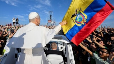 Pope Leo XIV touches an Ecuador flag, on the day of a Mass for Jubilee of Youth in Tor Vergata, in Rome, Italy, August 3, 2025. (via REUTERS)