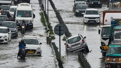 Gurugram: Commuters wade through a waterlogged Delhi-Gurugram expresssway after heavy rainfall, in Gurugram, Thursday, July 31, 2025. (PTI) Gurugram: Commuters wade through a waterlogged Delhi-Gurugram expresssway after heavy rainfall, in Gurugram, Thursday, July 31, 2025. (PTI)