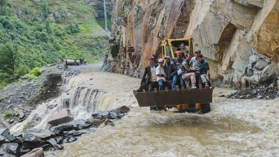An excavator being used to assist people to cross a stream in Lahaul and Spiti district of Himachal Pradesh. (PTI) An excavator being used to assist people to cross a stream in Lahaul and Spiti district of Himachal Pradesh. (PTI)