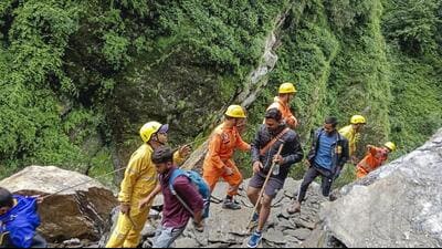 Pilgrims en route to Badrinath are being asked to cross the bridge on foot. (PTI) Pilgrims en route to Badrinath are being asked to cross the bridge on foot. (PTI)