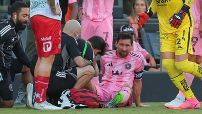 Lionel Messi receives treatment after being injured during Inter Miami's Leagues Cup match vs Necaxa. (IMAGN IMAGES via Reuters Connect)