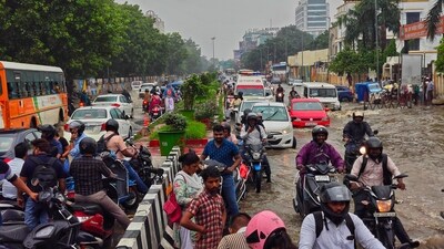 Commuters faced severe waterlogging and traffic snarls due to the heavy rainfall in the city. (HT Photo) Commuters faced severe waterlogging and traffic snarls due to the heavy rainfall in the city. (HT Photo)