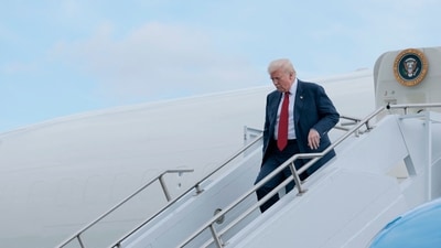 US President Donald Trump walks off Air Force One at the Lehigh Valley International Airport on August 01, 2025 in Allentown, Pennsylvania. (AFP) US President Donald Trump walks off Air Force One at the Lehigh Valley International Airport on August 01, 2025 in Allentown, Pennsylvania. (AFP)
