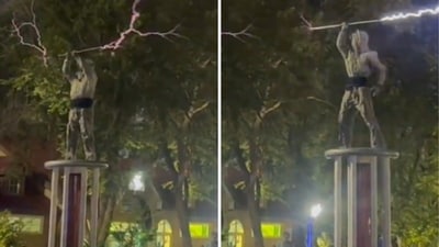 In the now-viral clip, the two performers don custom-designed suits that shield their bodies from high-voltage electricity. (X/MarioNawfal) In the now-viral clip, the two performers don custom-designed suits that shield their bodies from high-voltage electricity. (X/MarioNawfal)
