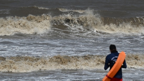 The duo approached the sea even after being cautioned by the lifeguards of the Brihanmumbai Municipal Corporation, (AFP)