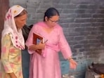 (Right) DEO Ravinder Kaur interacting with mid-day meal worker during her surprise visit in GPS Girls School, Ayali Kalan in Ludhiana on Monday. (HT Photo)